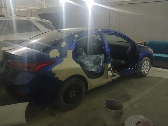 Saloon in primer during bodywork